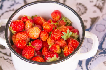 fresh strawberries in a bowl. fresh harvest of berries close up