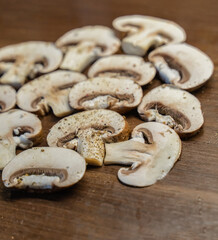 champignon sliced into slices on a wooden background