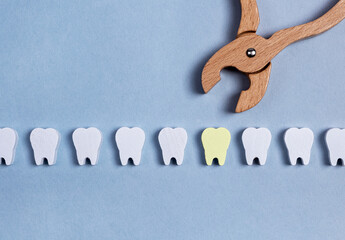 Extracting caries tooth from healthy teeth row. High quality photo