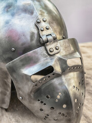 close-up of an iron helmet with a visor, part of a warrior's ammunition