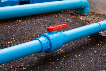 plastic pipes with valve, modern water supply system close up