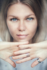 Portrait of a blonde woman with freckles - 514800773