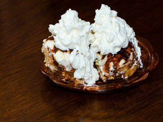 Hungarian sponge cake with whipped cream on a table