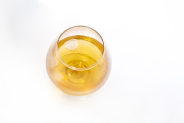 transparent glass with whiskey top view on white isolated background