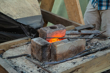 hammer in the blacksmith's forge close-up, heating up the metal