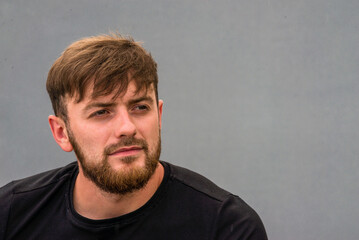 Obraz premium Handsome Young caucasian men, man stubble beard, Portrait wearing khaki shirt countryside, gray background, nature, sexy men bodybuilder, summer day, blue old car vintage, reflection in glass, rain