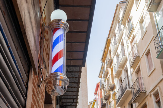 Barber pole on a city street.