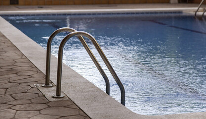 Swimming pool access stairs