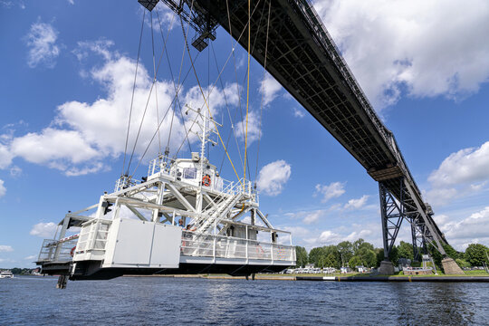 OSTERR&Ouml;NFELD, GERMANY - JUNE 12, 2022: hanging ferry under the Rendsburg High Bridge in Schleswig-Holstein, Germany