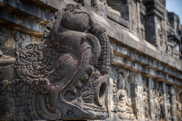 carvings and statue at Candi Borobudur temple