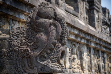 Fototapeta na wymiar carvings and statue at Candi Borobudur temple