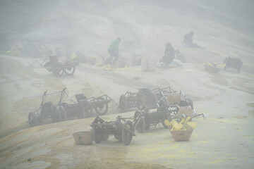 sulphur workers on mt ijen volcano