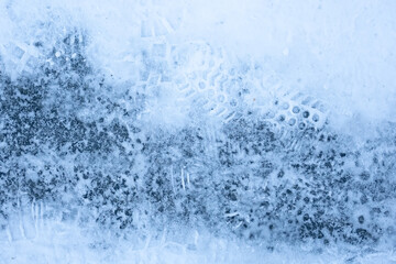 Naklejka na ściany i meble Texture of footprints from boots on the snow