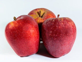 Three apples on white background.