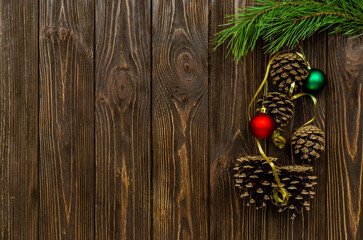 Christmas tree branch cones on a wooden table
