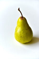 Green delicious pear on a white background
