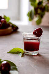 Shorts with cherry alcoholic drink.