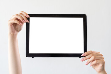 Mobile technology. Digital information. Advertising background. Female hands holding tablet computer with blank screen isolated white.