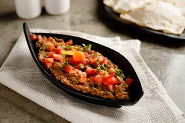 Ful Medames with bread served in a dish isolated on grey background side view fast food