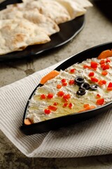 Moutabel Salad served in a dish isolated on grey background side view fast food