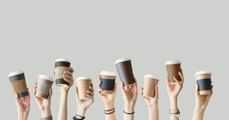 Many different arms raised up holding coffee cup - 514826175