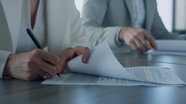 Business people sign contract in office. Closeup hand holding pen put signature