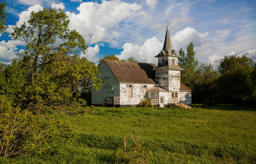Fototapeta na wymiar A abandoned country church in a wetland in north easter North Dakota.