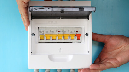 Electrical work to upgrade electric panel with circuit breakers of consumer unit.