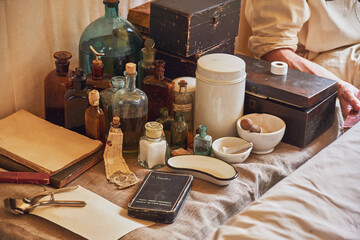 An old military field hospital with retro tents and vintage medical beds from the First World War. Mobile clinic for the treatment of soldiers of the early twentieth century