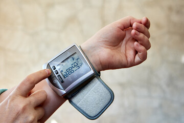 Electronic wrist blood pressure monitor tonometer and heart rate with cuff.