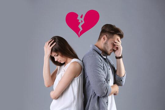 Upset young couple and illustration of broken heart on grey background. Relationship problems