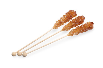 Wooden sticks with sugar crystals isolated on white, top view. Tasty rock candies