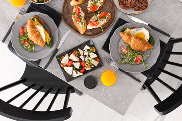 Many different dishes served on buffet table for brunch, flat lay