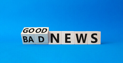 Good news and Bad news symbol. Turned wooden cubes with words Good news and Bad news. Beautiful blue background. Business concept. Copy space