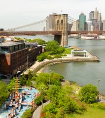 Poster Aerial view of Brooklyn Bridge park with the bridge and Manhattan in the distance © James