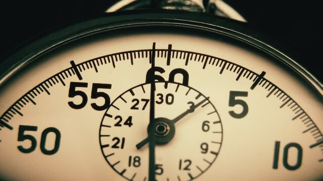 Analog stopwatch close-up. Counting time by stopwatch. Time measurement. Time management concept.A tool for measuring time.Dial stopwatch arrow.