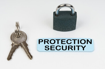 On a white surface there is a lock, keys and a blue sign with the inscription - Protection security