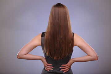Obraz premium Back woman with long hair isolated female portrait.