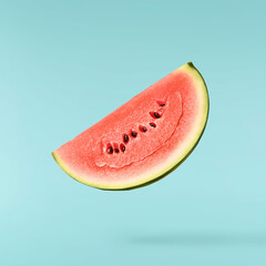 Fresh raw watermelon falling in the air isolated