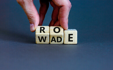 Abortion process Roe versus Wade symbol. Concept words Roe versus Wade on wooden blocks. Lawyer...