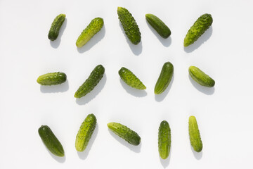 cucumbers with shadow lie on a white background