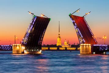 Fototapeta na wymiar Open Palace bridge and Peter and Paul cathedral at white night, Saint Petersburg, Russia