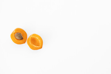 Fresh whole and sliced apricot. Isolated. White background