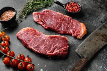 New-York  steak, on black dark stone table background