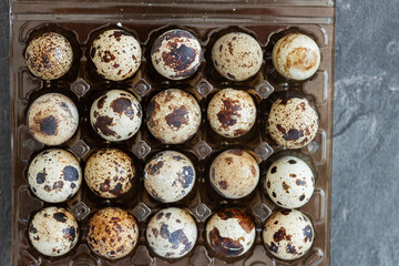 Many fresh quail eggs on background, closeup