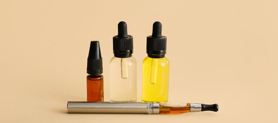 Electronic cigarette with oil in bottles on light background with space for text