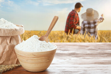 Farmers in field on sunny day