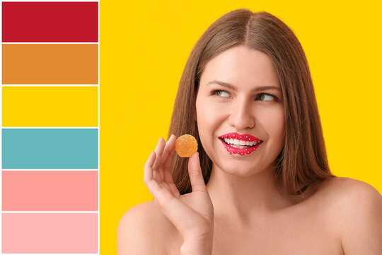 Beautiful young woman with creative makeup and candy on yellow background. Different color patterns