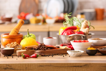 Different spices and products on table in kitchen