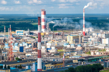 aerial view on pipes of chemical enterprise plant. Air pollution concept. Industrial landscape environmental pollution waste of thermal power plant